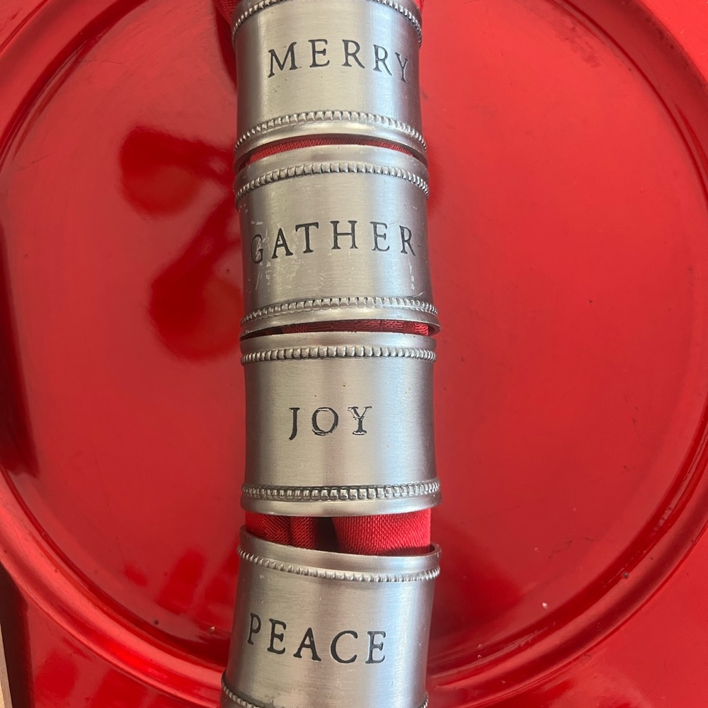 Magnolia Brand Christmas Napkin Rings. Silver/pewter color engraved in black.